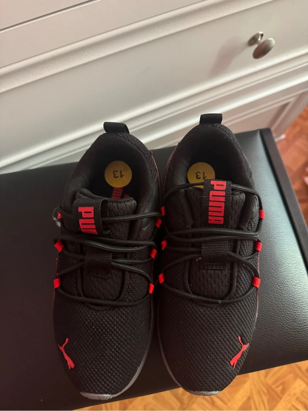 Puma Kids Black Sneakers with Red Accents